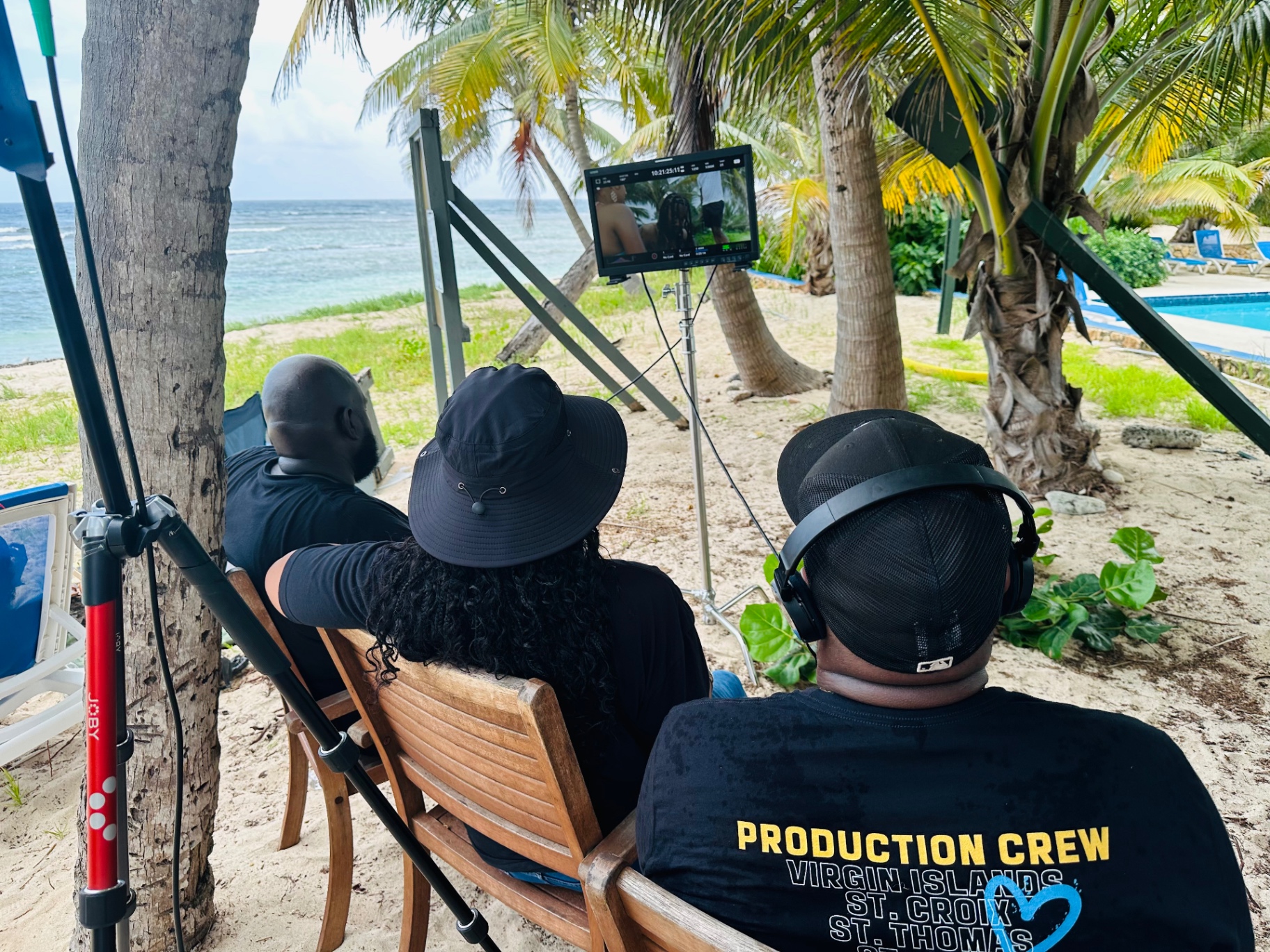 Reviewing playback at the director's monitor on a Virgin Islands beach set